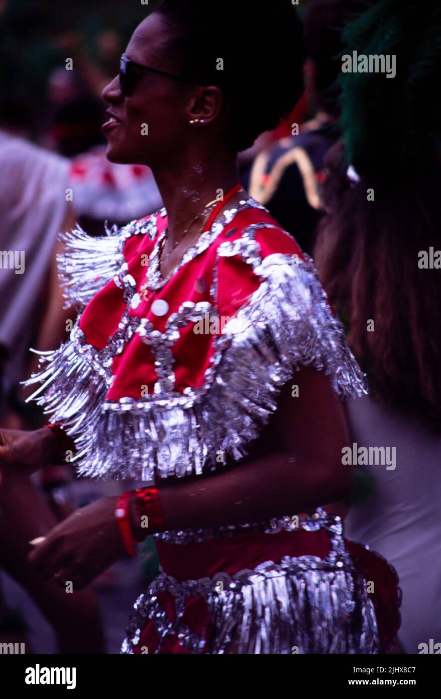 People in procession dancing on streets at Easter carnival, Kingston