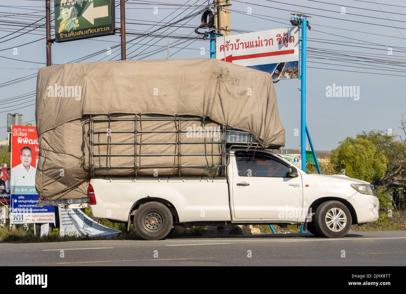 BANGKOK, THAILAND, APR 29 2022, A full loaded pick up car drives on the