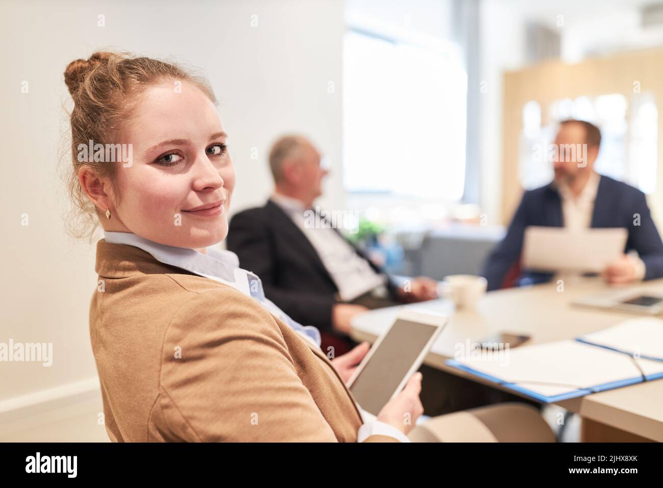 Young business woman as a start-up founder with tablet computer at the conference table in the office Stock Photo