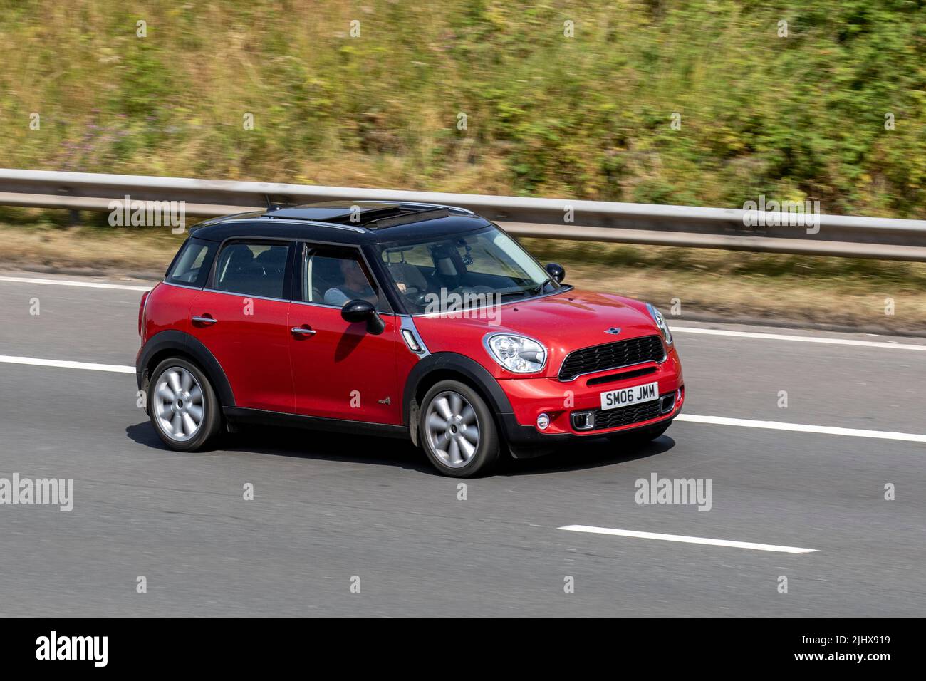 2013 red Mini Countryman Cooper  SD ALL4 1995cc Diesel SUV4 speed manual; travelling on the M6 Motorway, UK Stock Photo