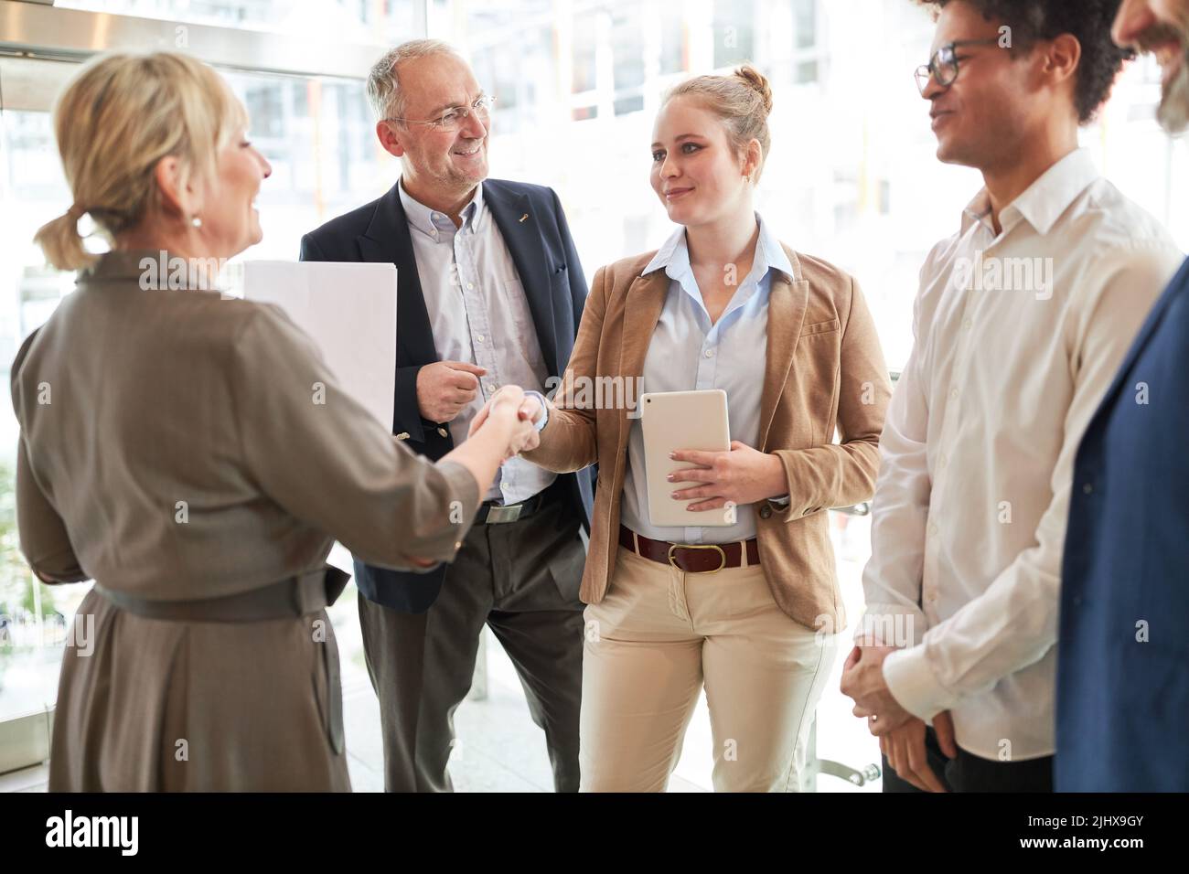 Business woman congratulates trainee or applicant for promotion or hiring in office Stock Photo