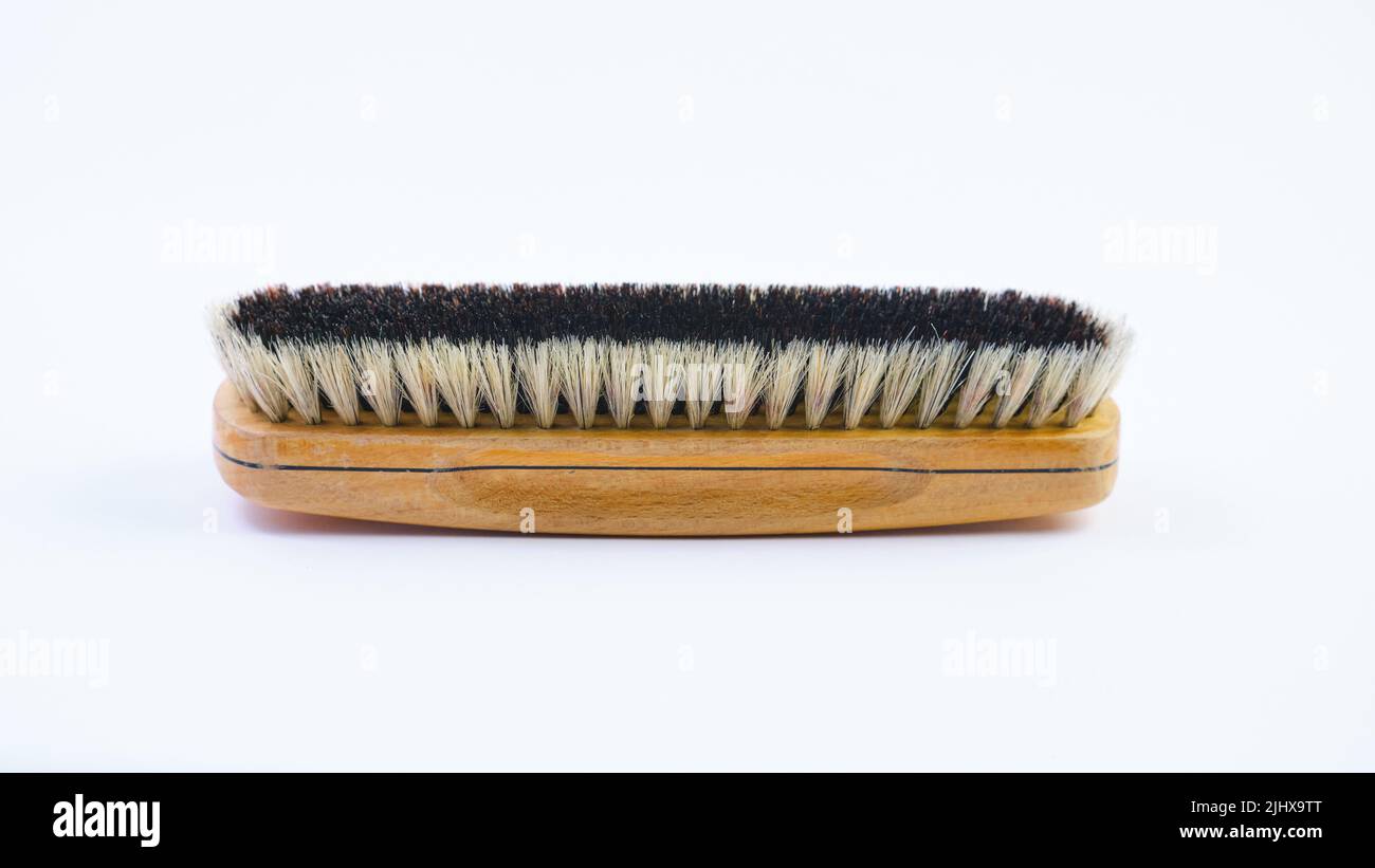 Wooden shoe brush horsehair brush for leather shoe polishing on white background Stock Photo
