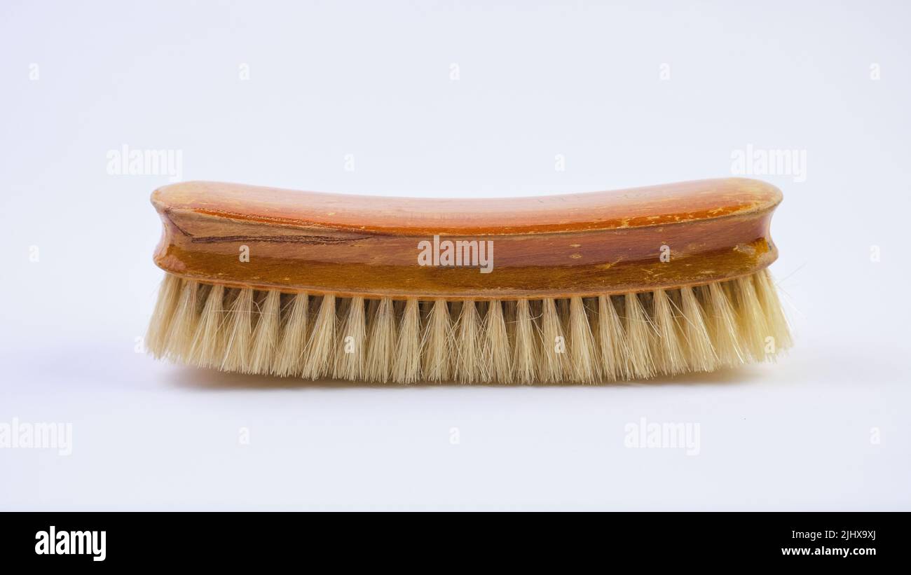 Wooden shoe brush horsehair brush for leather shoe polishing on white background Stock Photo
