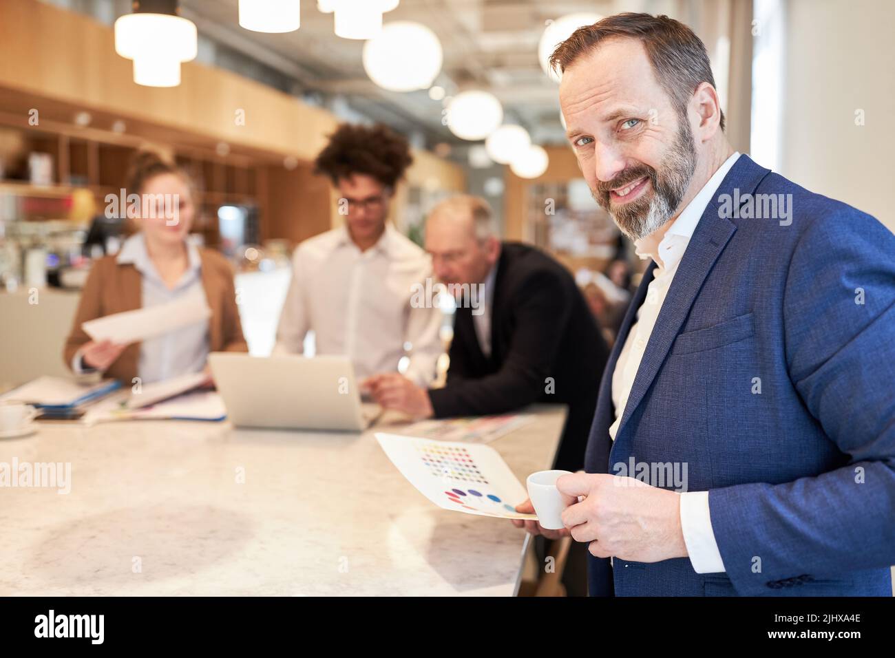 Confident business man as head of an advertising agency in a meeting in ...