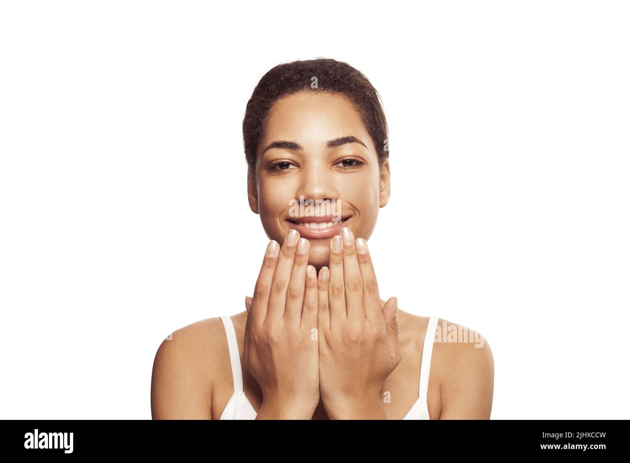 Happy young black woman smiling isolated on white background Stock ...