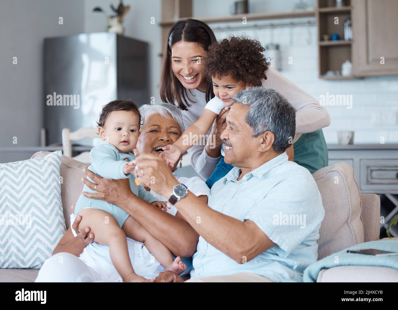 These bonds are shackle-free. a beautiful family bonding on a sofa at home. Stock Photo
