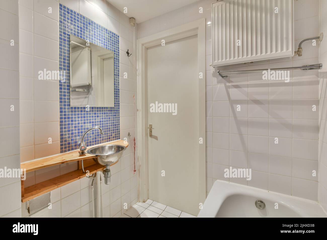 Modern home interior design of white bathroom with open bathtub and