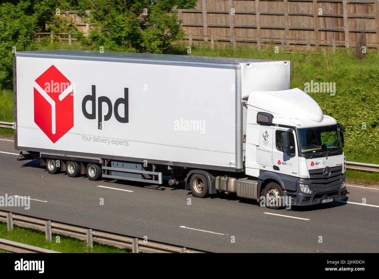 DPD Delivery 2016 White Mercedes Benz 1843LS HGV10677 cc Diesel truck; travelling on the M6 Motorway, UK Stock Photo