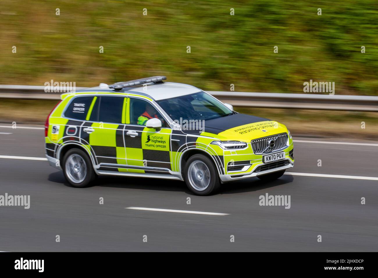 National Highways Agency Traffic Officer driving Volvo Xc90 Momentum T8 Rchrg Awd A estate, plug-in hybrid SUV patrol vehicle; travelling on the M6 Motorway, UK Stock Photo