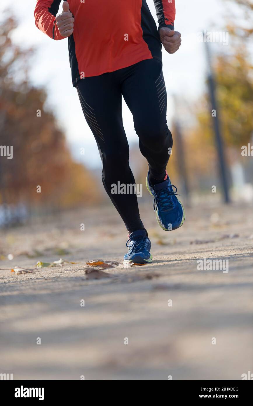 A Close-up of man running on pathway Stock Photo - Alamy