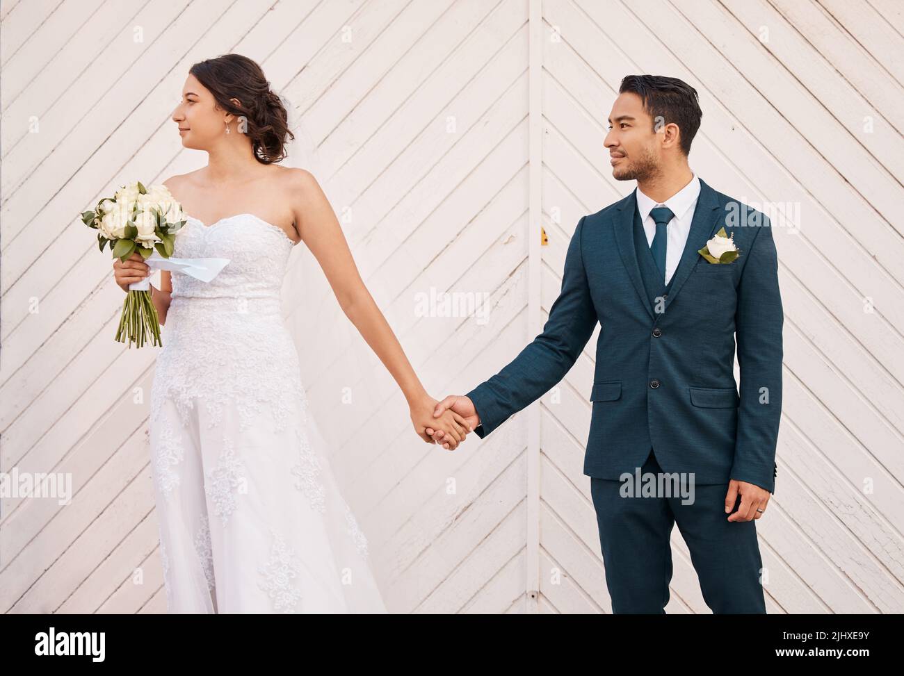 Love recognizes no barriers. a beautiful couple out in the city on their wedding day. Stock Photo