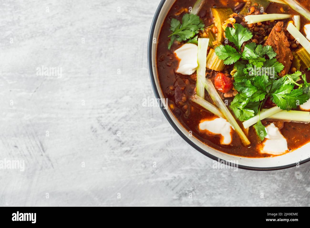 plantbased Mexican vegetable stew with beans mock meat celeri and