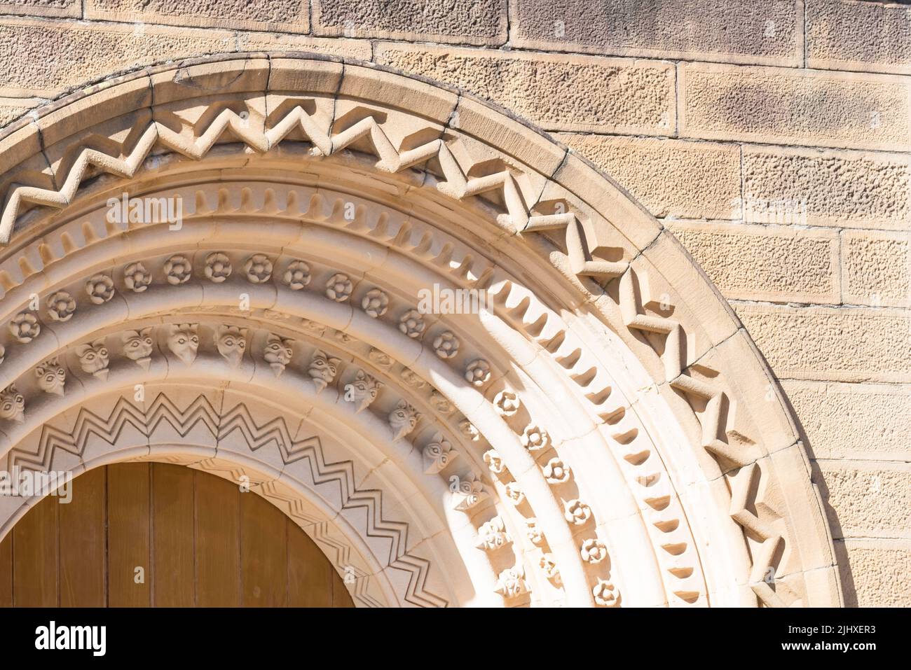 Close-up images of the detailed and complex sandstone carving over the doors and windows of St Johns Anglican cathedral in Parramatta, Australia Stock Photo