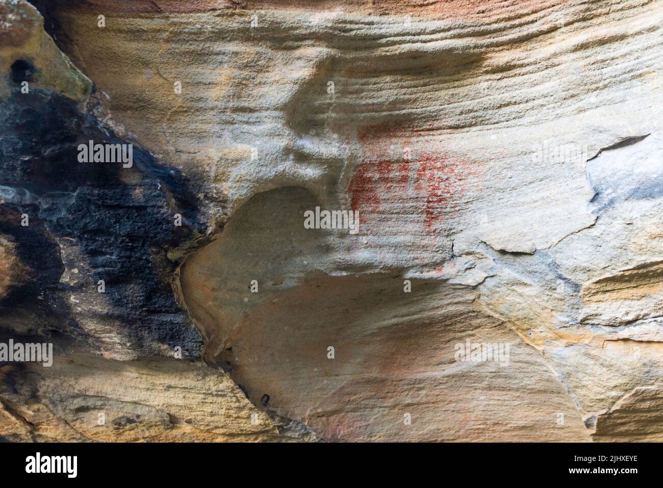 Red Hands Cave at West Head in Ku-ring-gai Chase National Park, Sydney contains ancient Aboriginal ochre rock paintings thought to be 2000 years old Stock Photo
