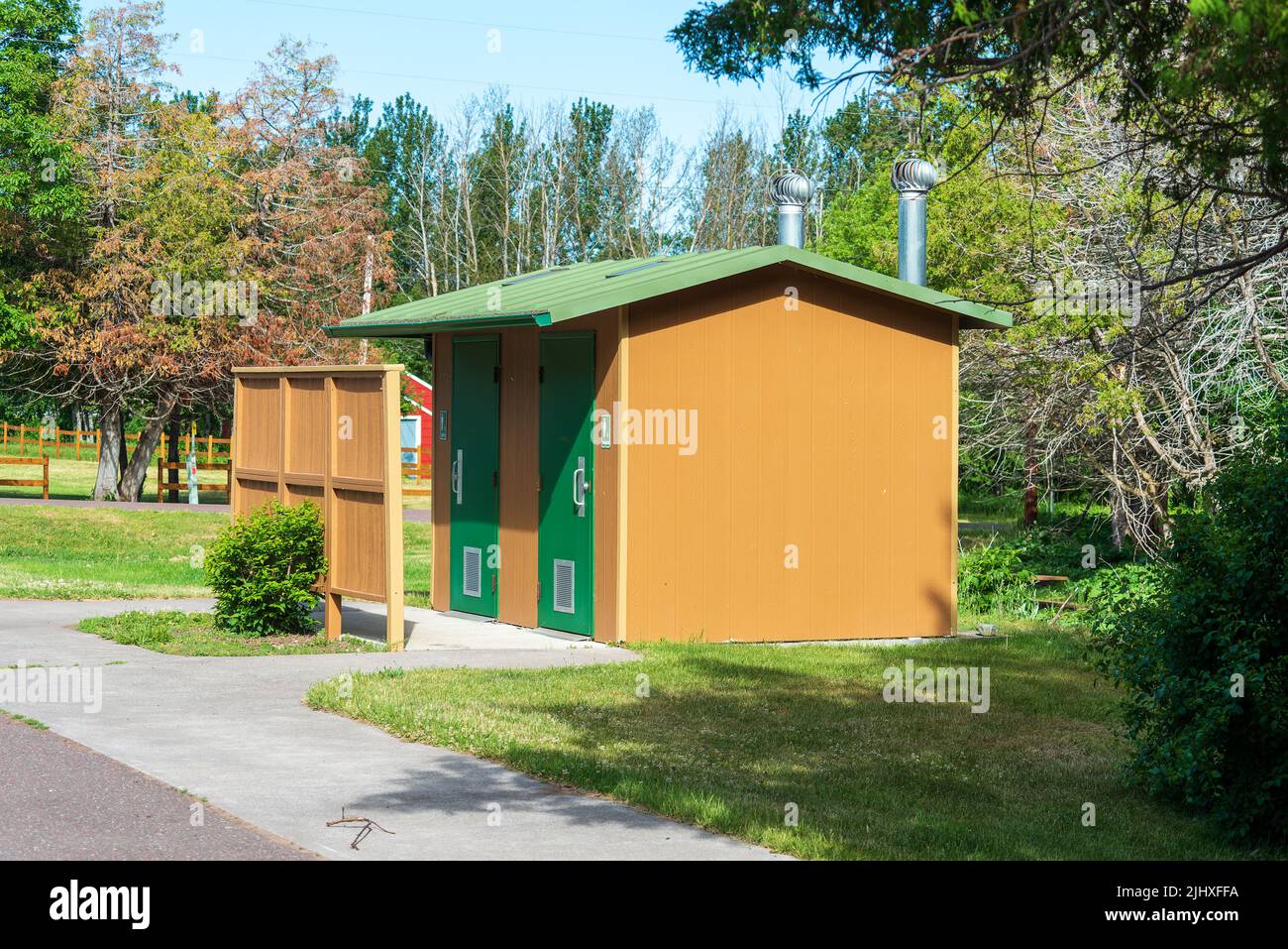 Rural public restroom facility located at a roadside park Stock Photo