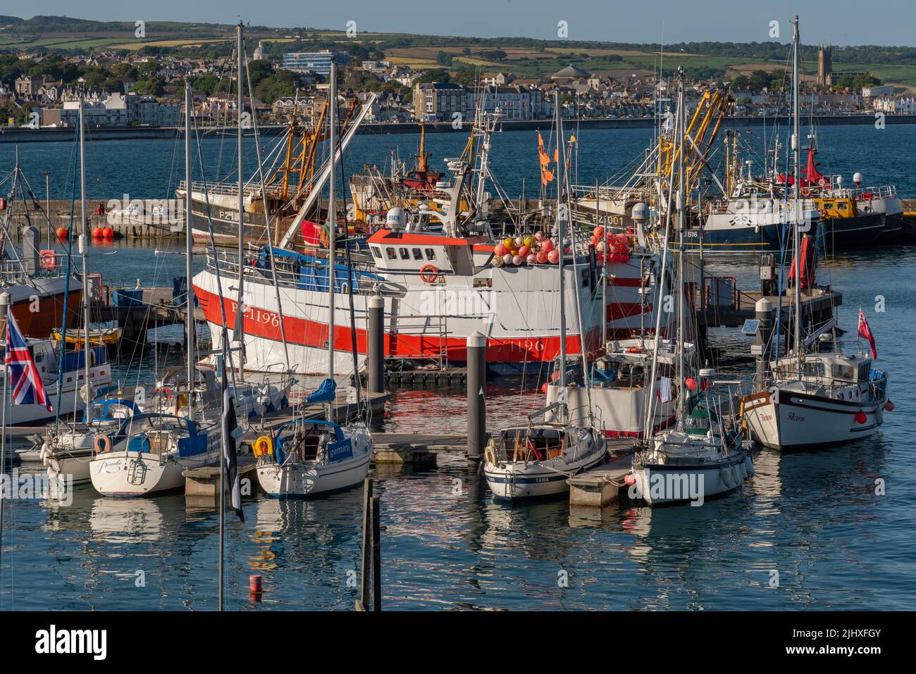 Newlyn Harbour, Penzance, Cornwall, England, UK. 2022. Commercial fishing boats and leisure craft in port at Newlyn Harbour, Stock Photo