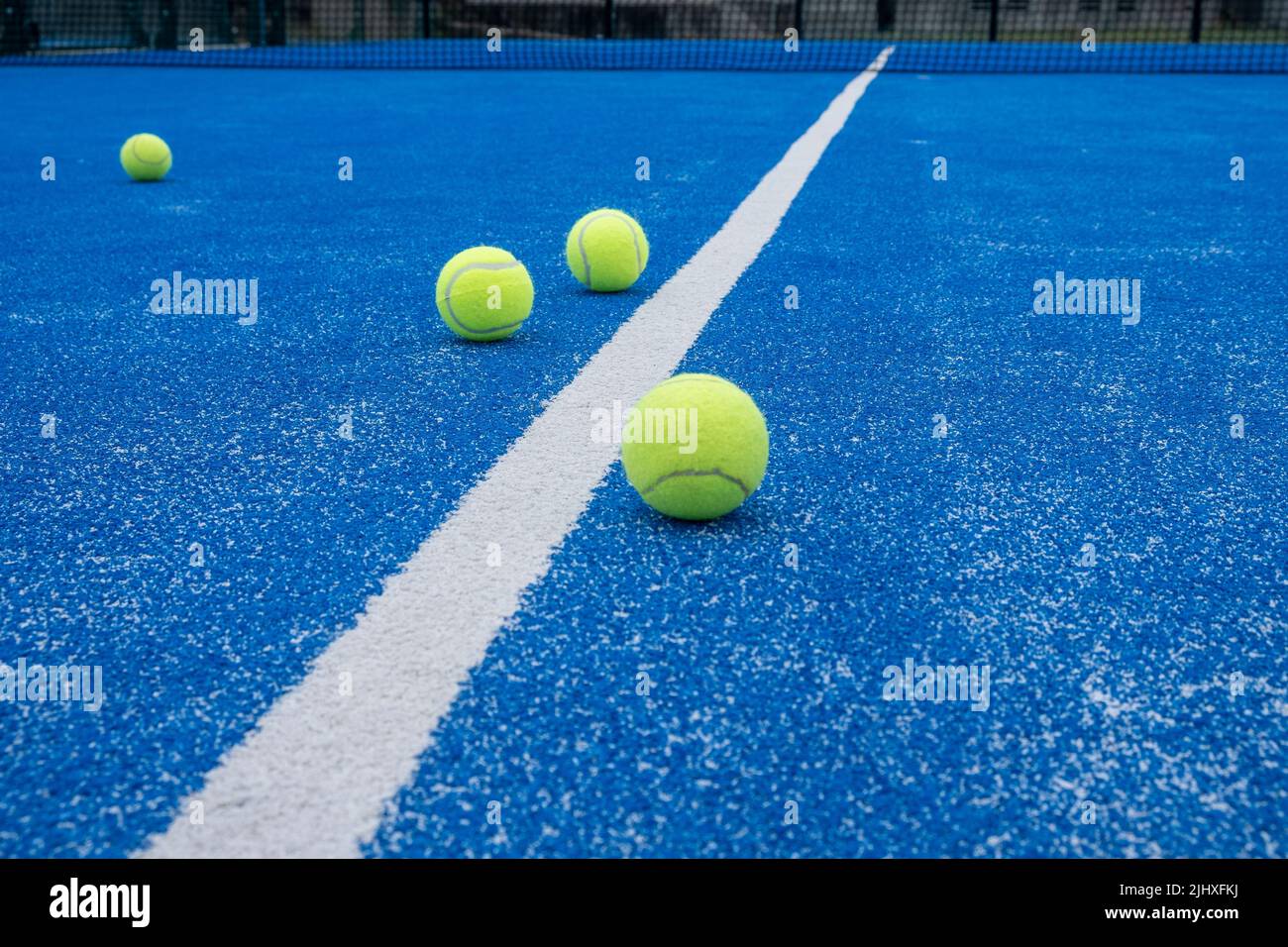 Paddle tennis balls on a paddle tennis court for background Stock Photo