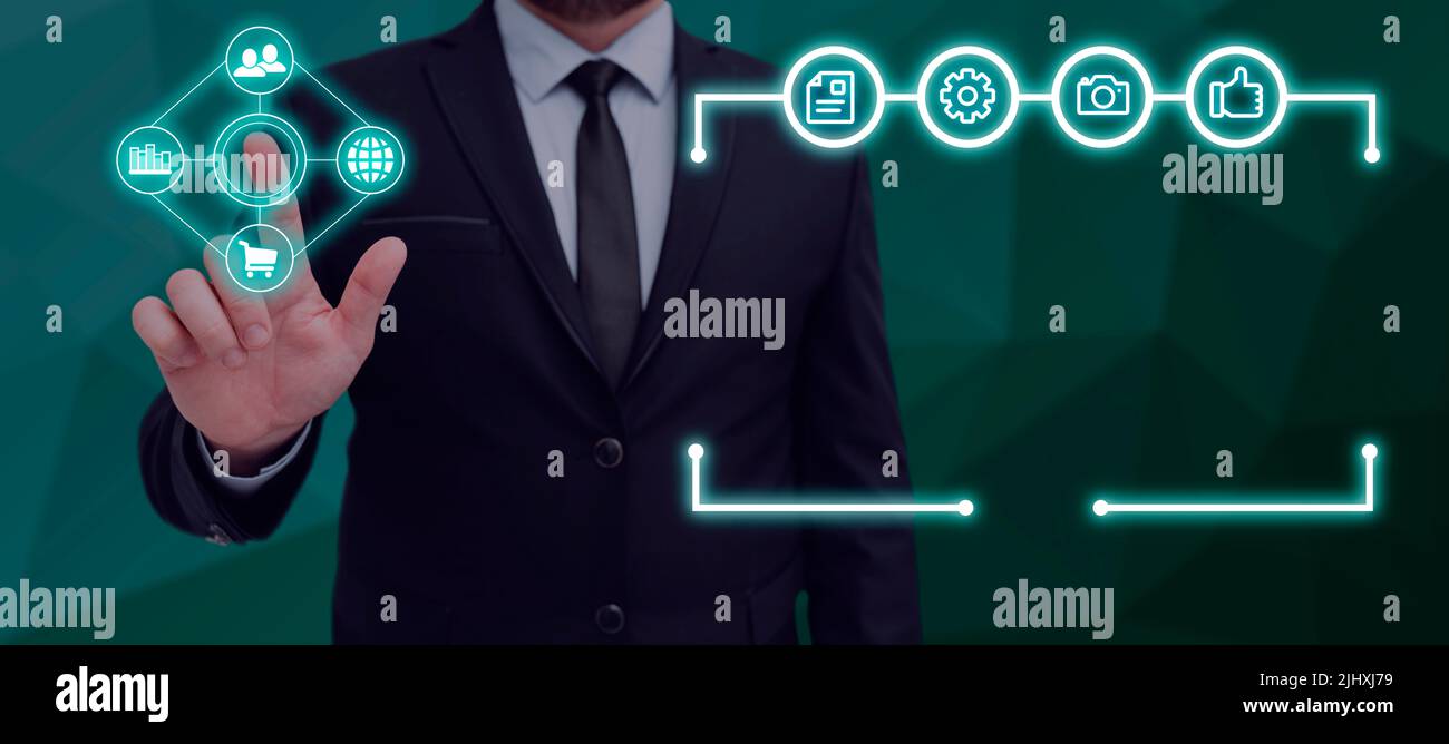 Businessman Pointing On Multiple Glowing Digital Symbols With A ...