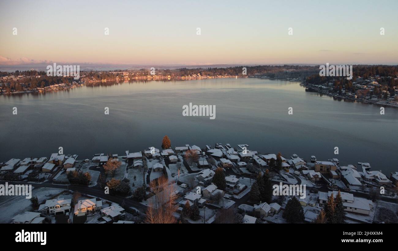 An aerial drone view of the eastside of Lake Stevens at sunset in winter Stock Photo