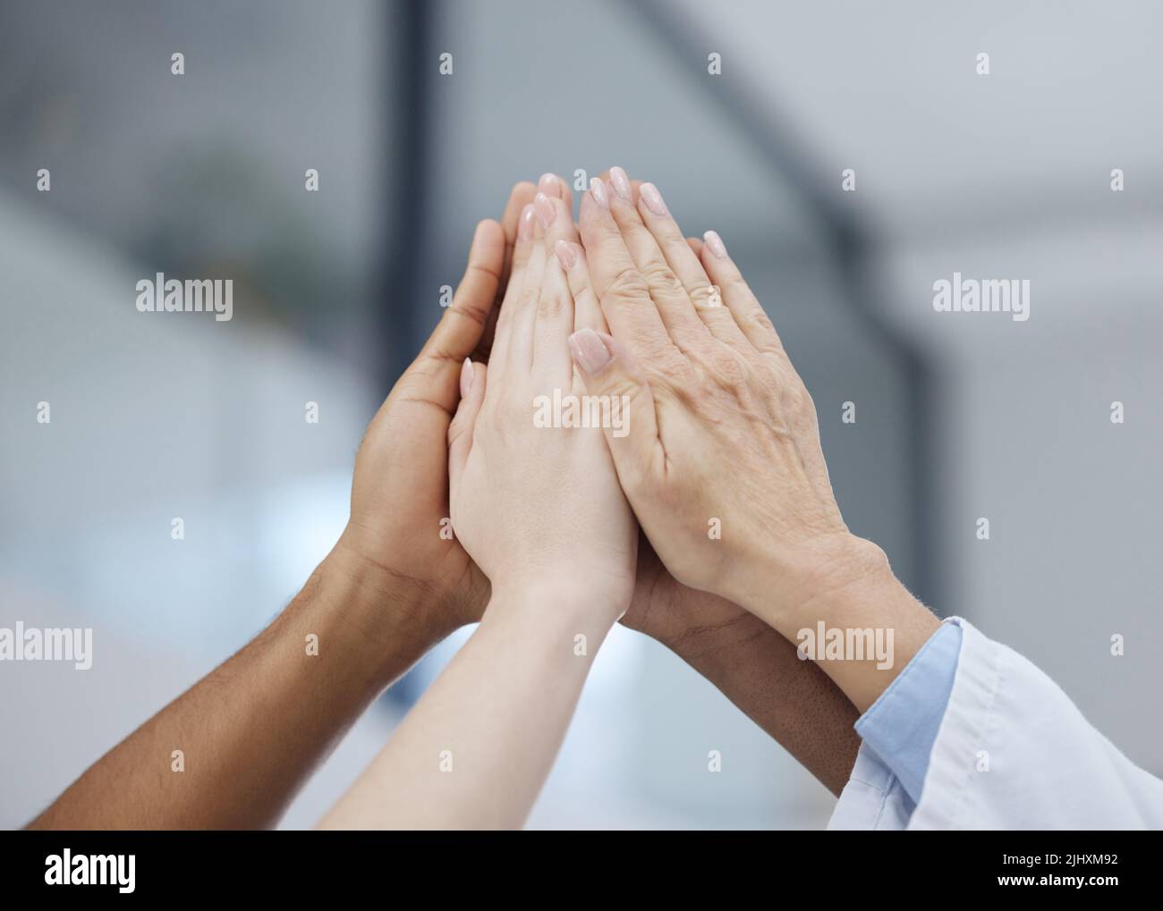 Male group high five hi-res stock photography and images - Alamy