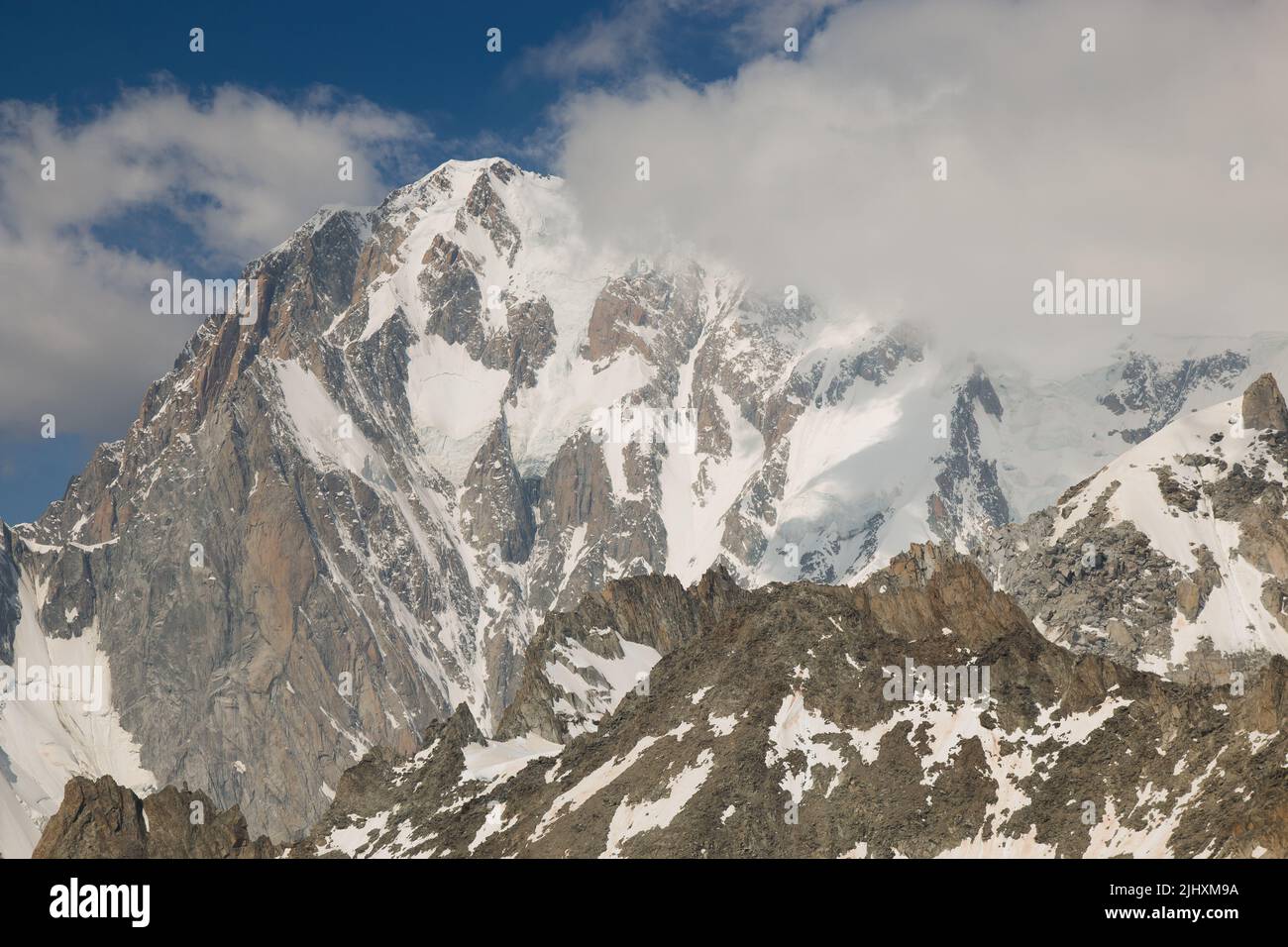 The peak of Pointe Helbronner covered by clouds in the massif of Mont Blanc Stock Photo