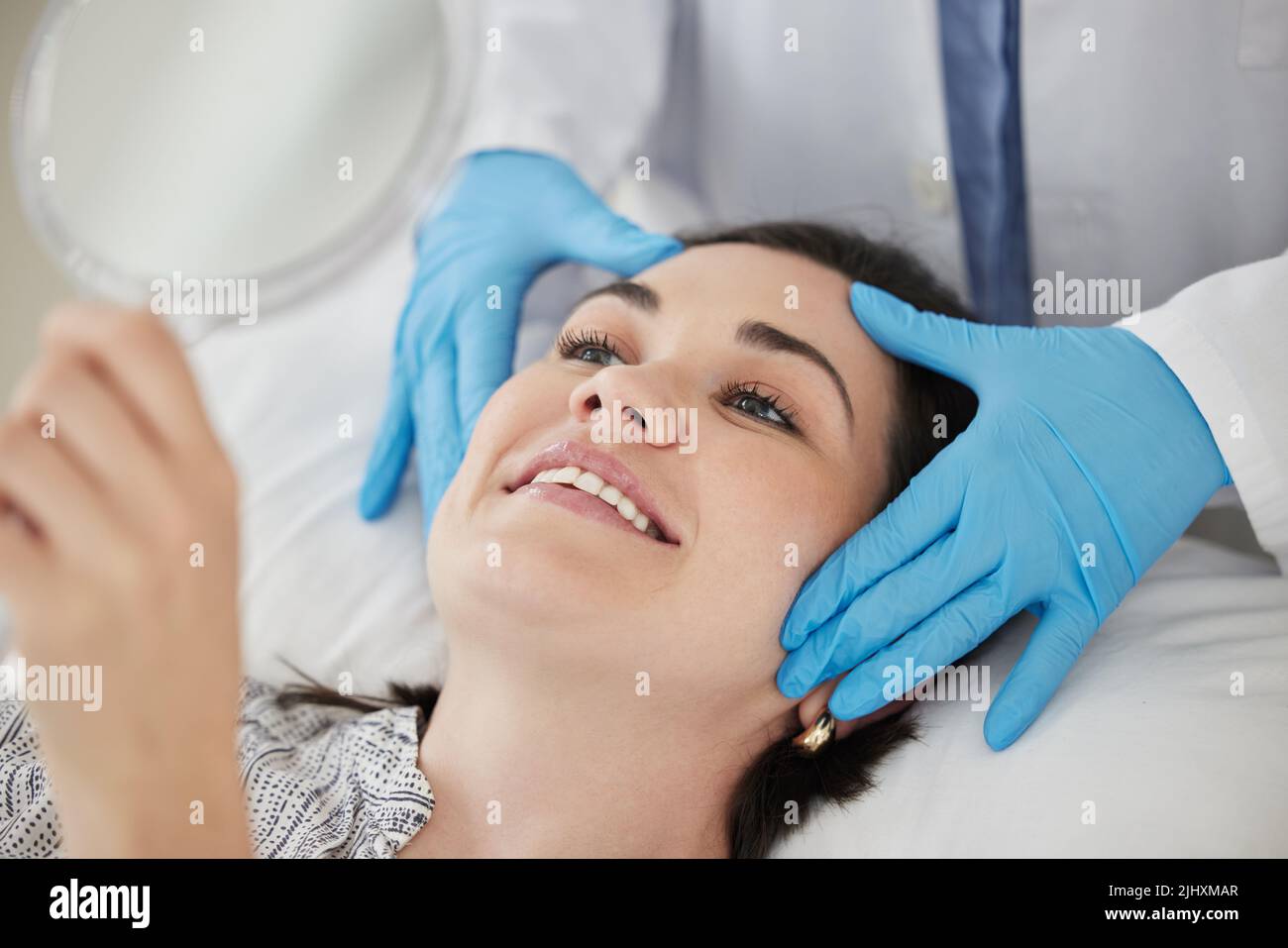Everything looks just perfect. a young woman checking her post ...