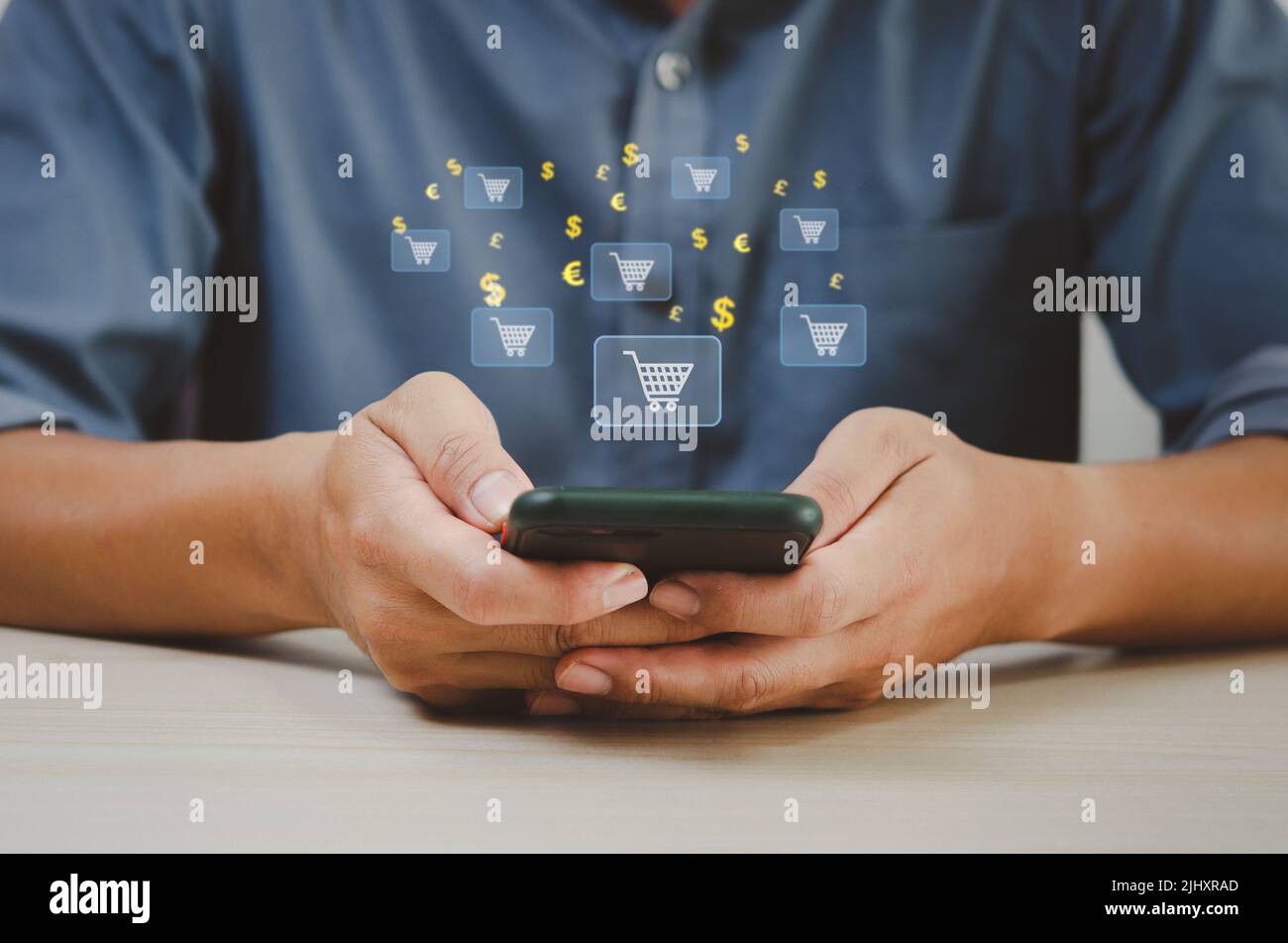 Businessman using smart phone shopping online virtual screen. Stock Photo
