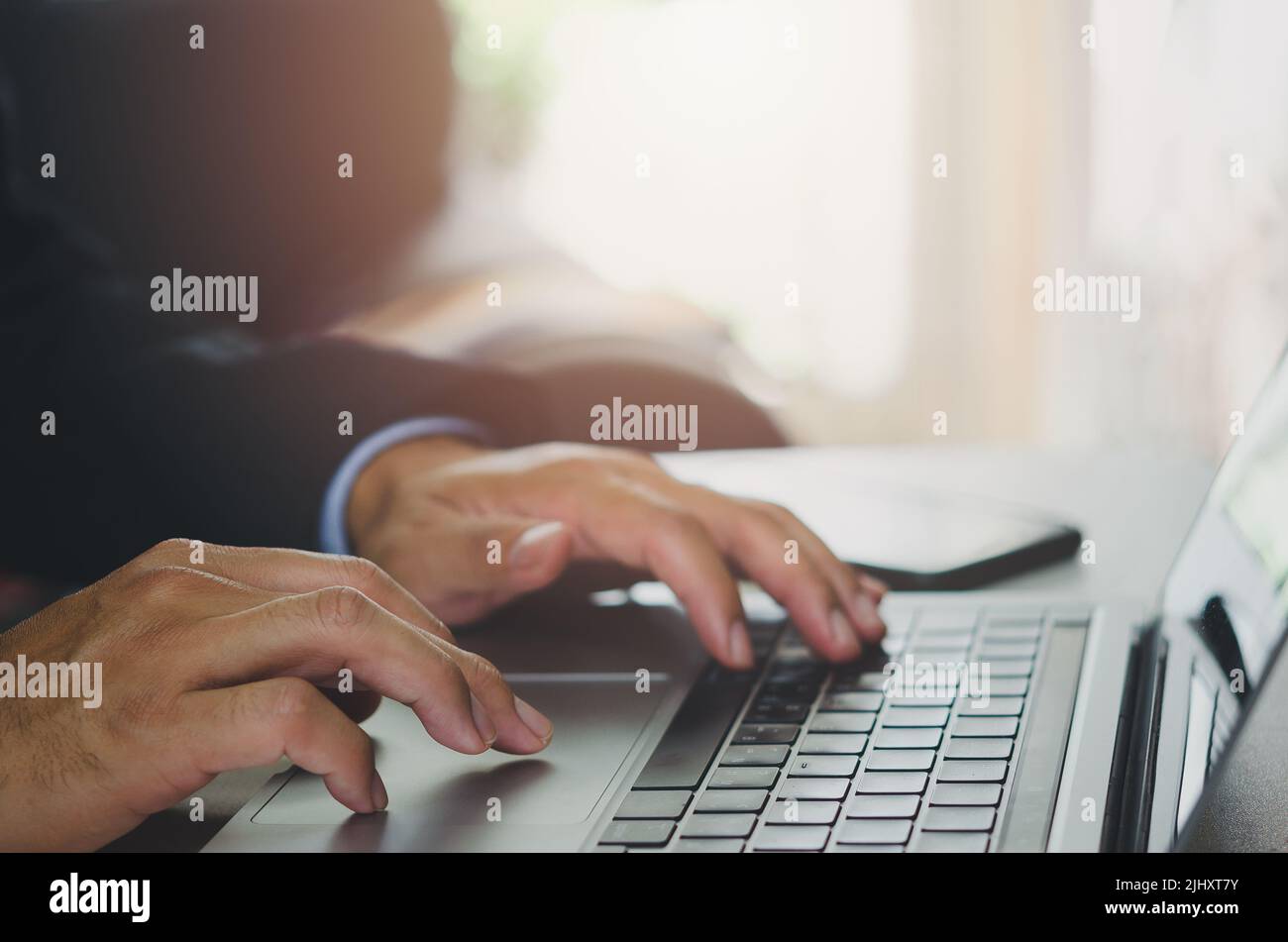 Businessman hand using laptop computer typing keyboard close-up. Online work. Internet. Planning research report at office. Stock Photo