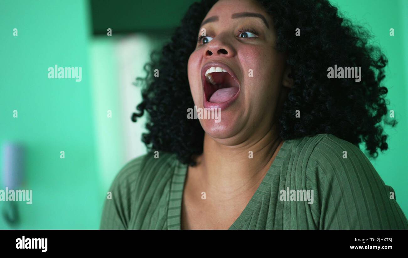 a-black-latina-woman-shocking-reaction-with-open-mouth-stock-photo-alamy