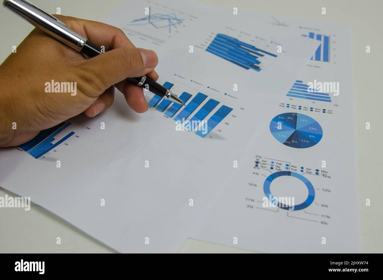 Business documents chart and graph finance statistic with pen.Paperwork ...