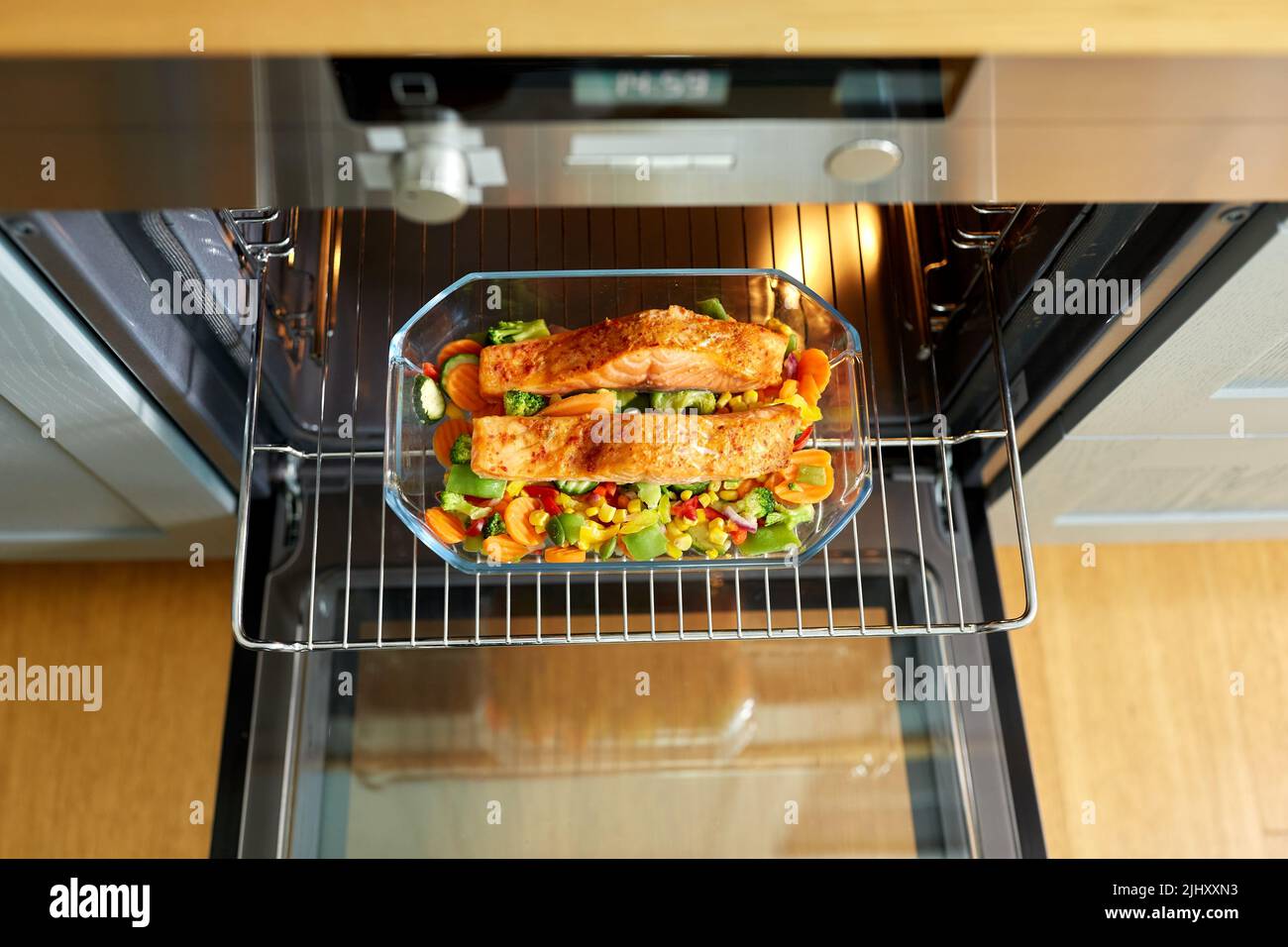food cooking in baking dish in oven at home Stock Photo Alamy