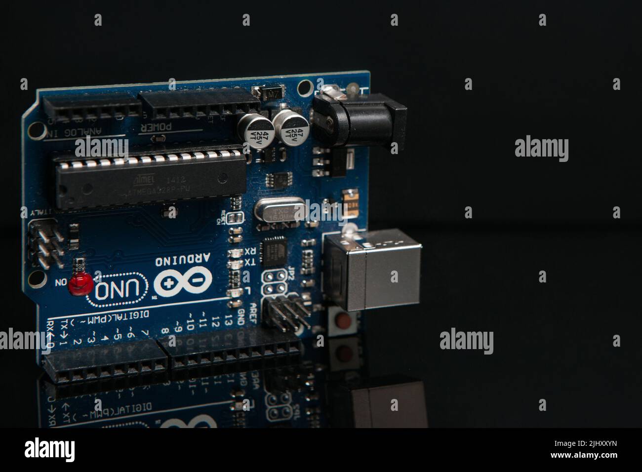 Arduino UNO board on black background Stock Photo - Alamy