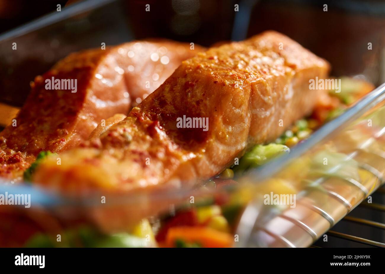 food cooking in baking dish in oven at home Stock Photo Alamy