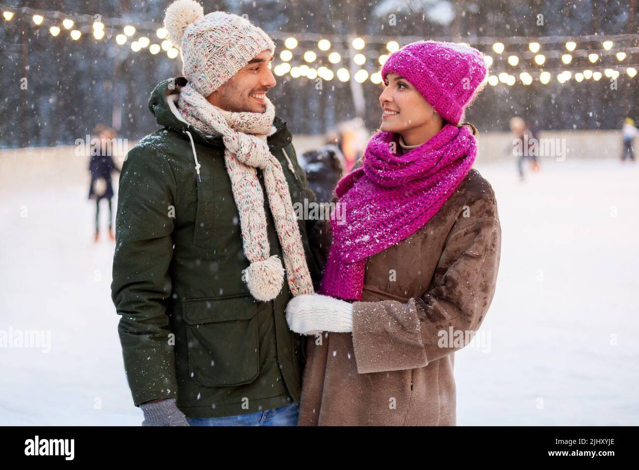 Active young couple ice skating hi-res stock photography and images - Alamy