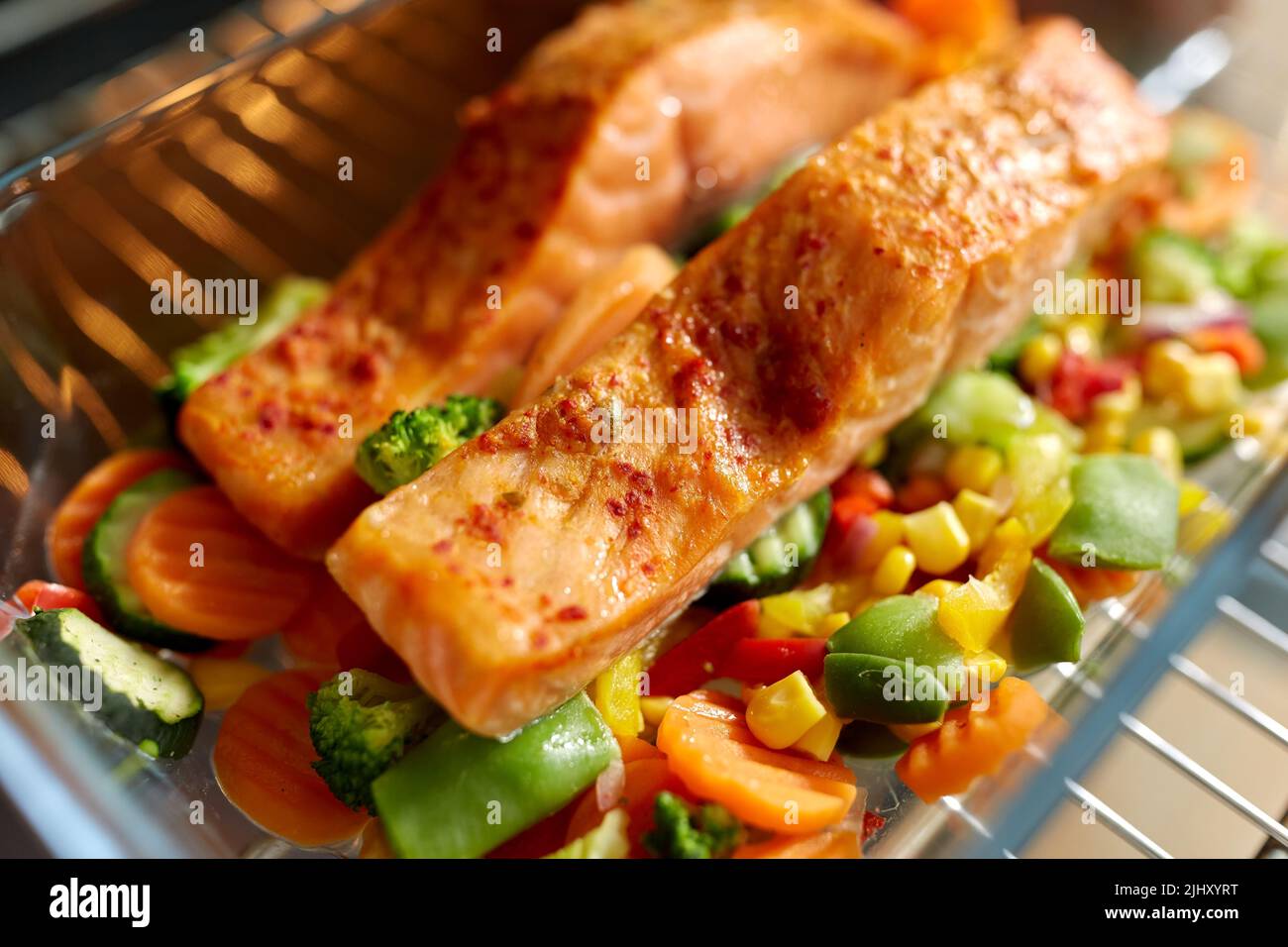 food cooking in baking dish in oven at home Stock Photo Alamy