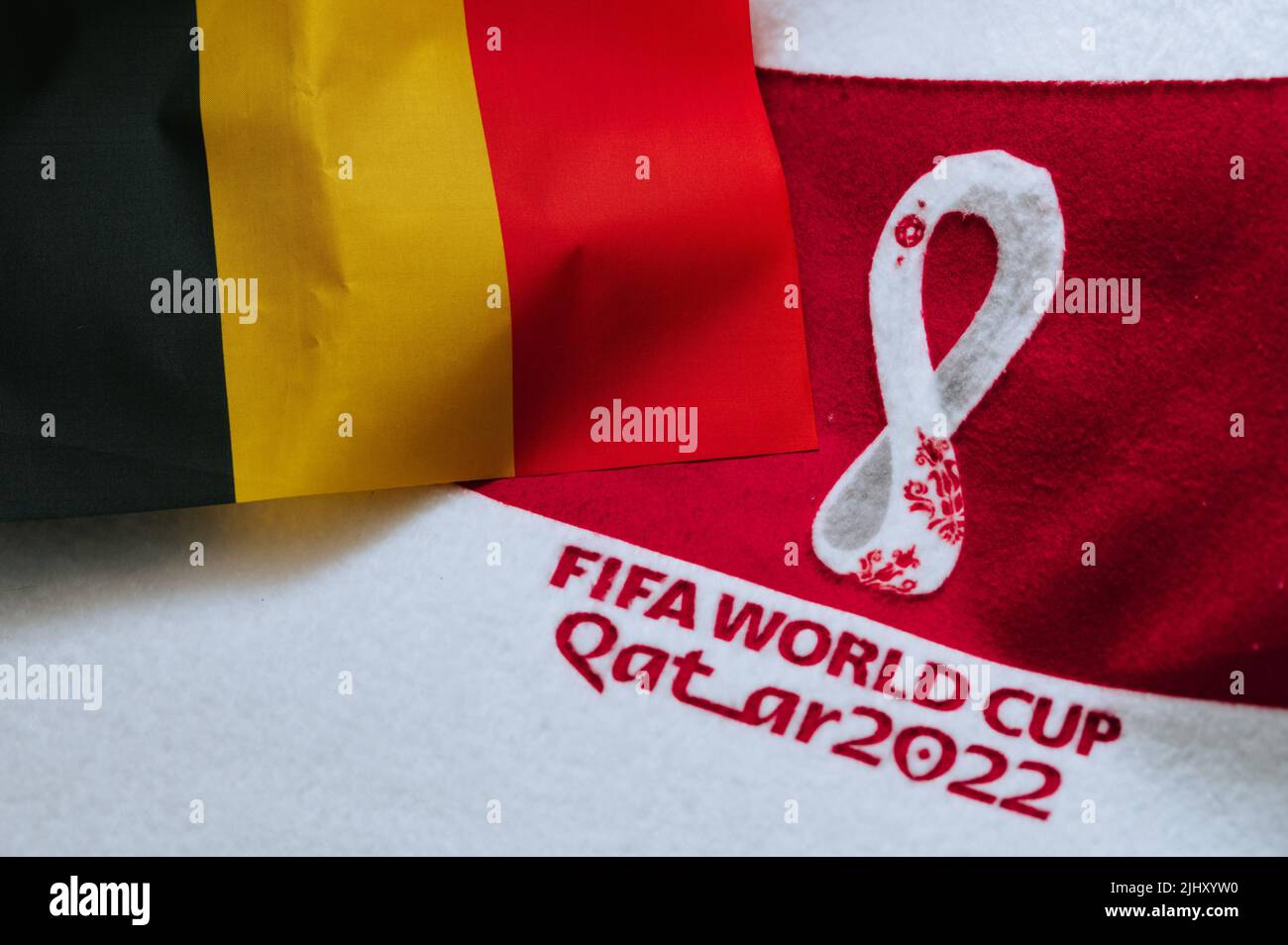 QATAR, DOHA, 18 JULY, 2022: Belgium National flag and logo of FIFA World Cup in Qatar 2022 on red carpet. Soccer sport background, edit space. Qatar 2 Stock Photo