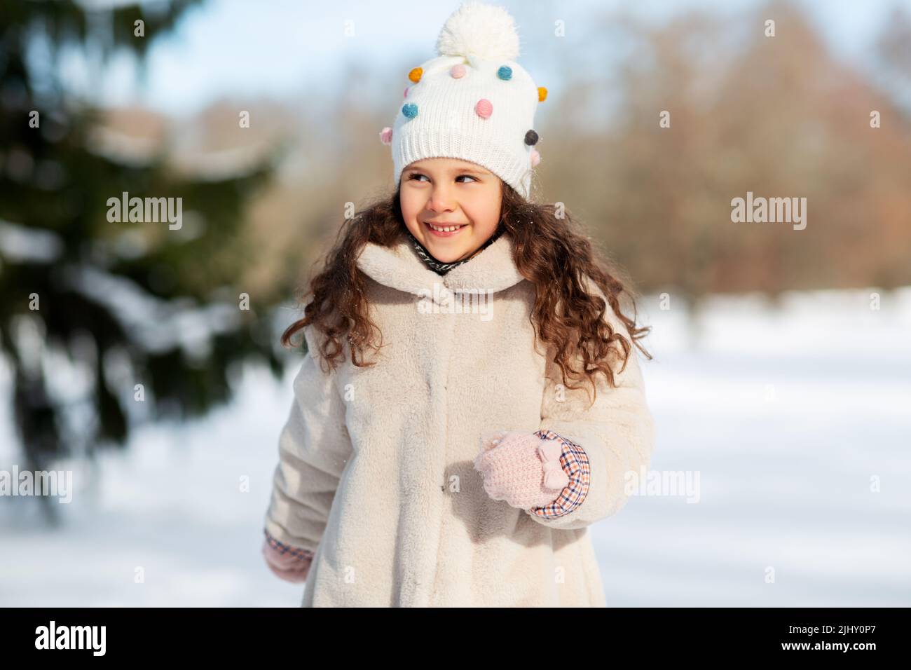 happy little girl in winter clothes outdoors Stock Photo - Alamy