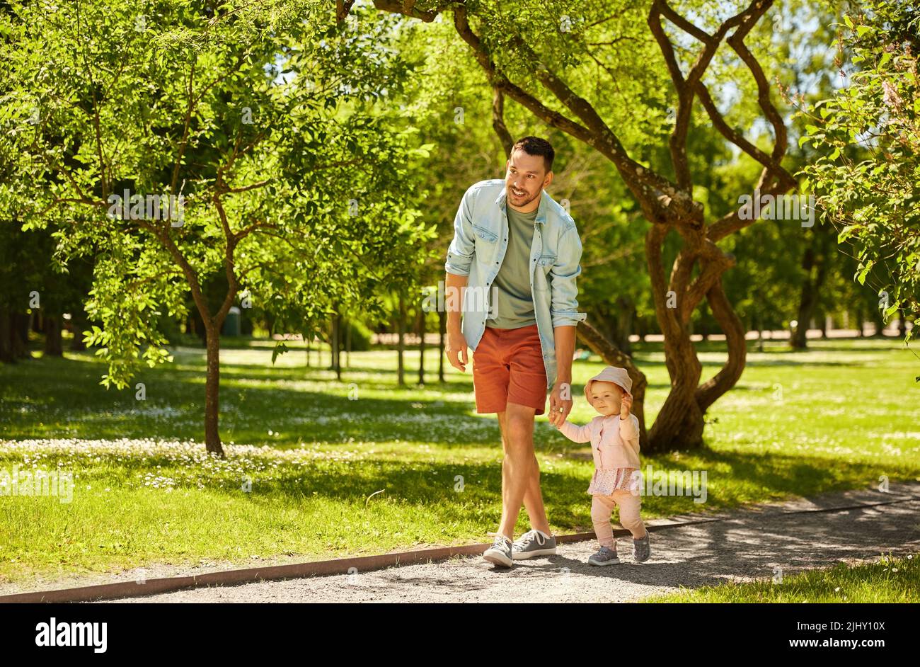 happy father with baby daughter at summer park Stock Photo - Alamy