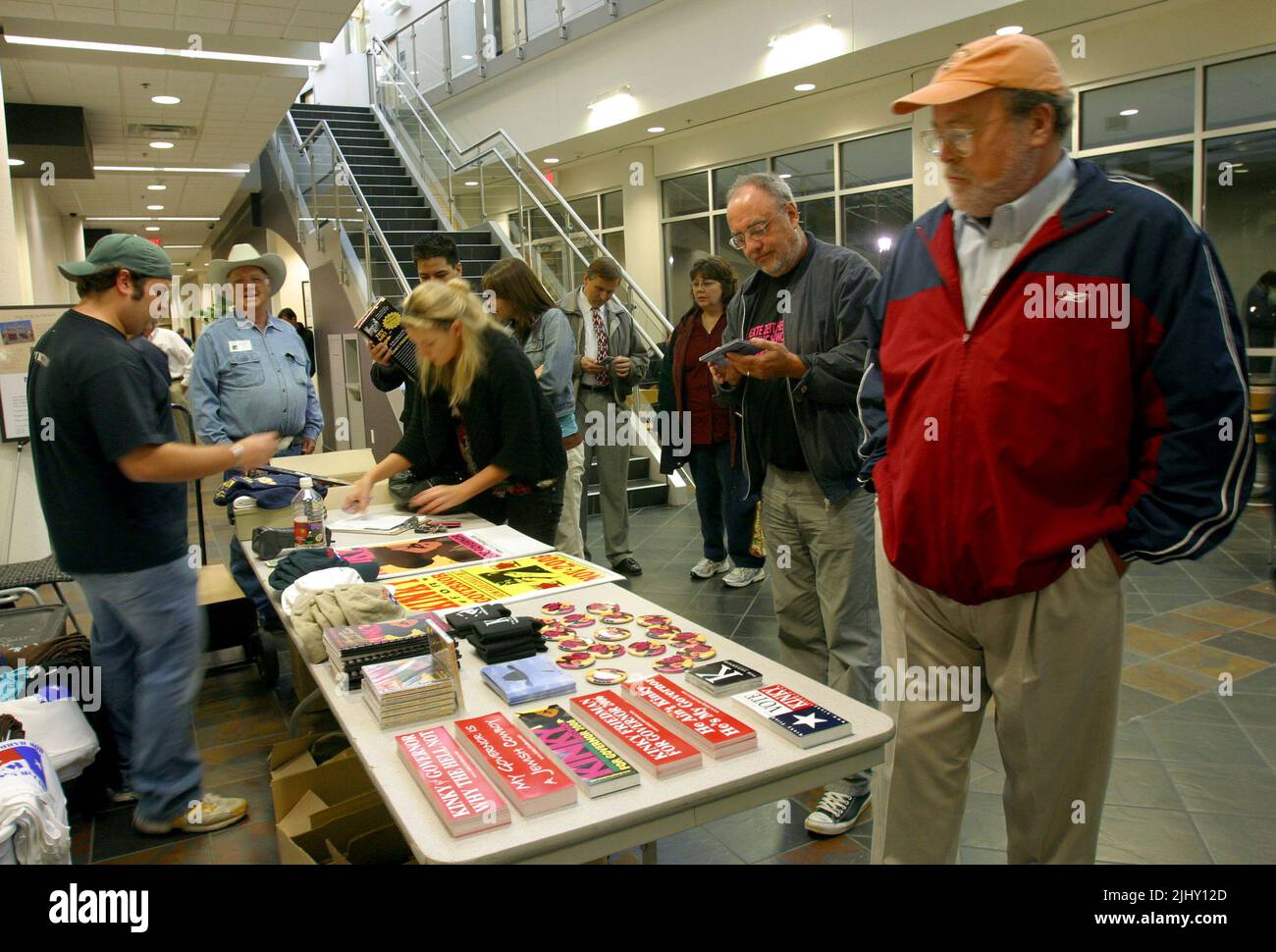 Kinky Friedman gubernatorial campaign Director of Merchandising Blake Waxler (left) talks with attendees as they examine a table full of bumper stickers, buttons, hats and other campaign merchandise during a campaign event on Thursday, Nov. 2, 2006 at Smith Entrepreneur Hall on the Texas Christian University campus in Fort Worth, Tarrant County, TX, USA. Friedman is one of two independent candidates hoping to unseat incumbent Republican Gov. Rick Perry to become the Lonestar State's first independent governor since Sam Houston in 1859. (Apex MediaWire Photo by Timothy J. Jones) Stock Photo