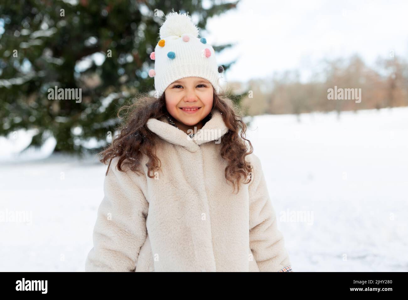 happy little girl in winter clothes outdoors Stock Photo - Alamy