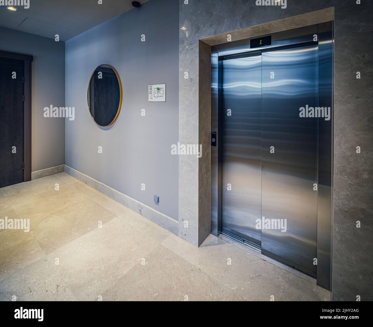 Modern interior of entrance in residential apartment building. Elevator