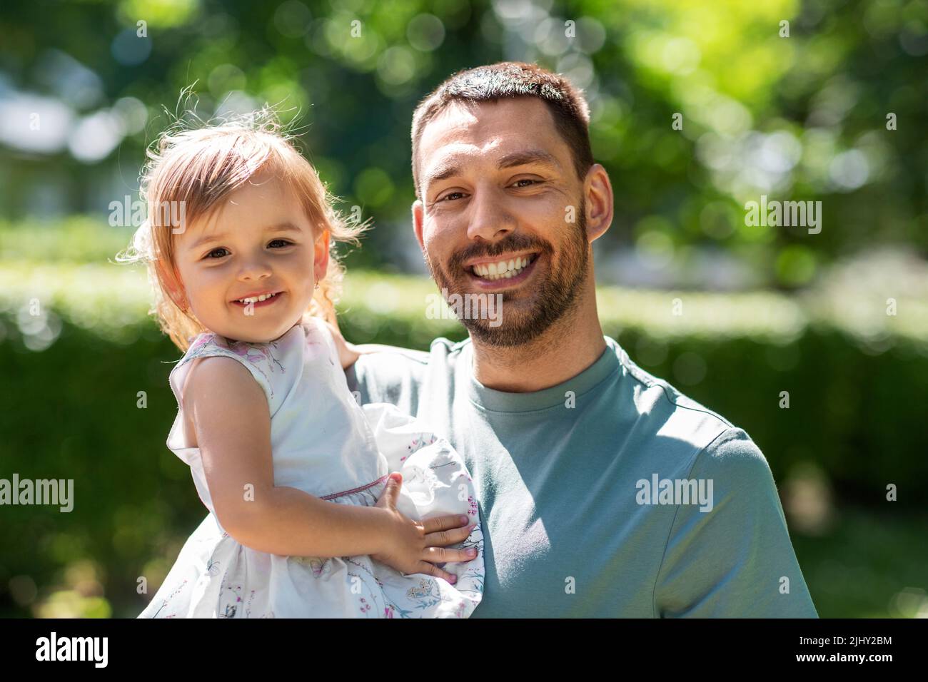 happy father with baby daughter at summer park Stock Photo - Alamy
