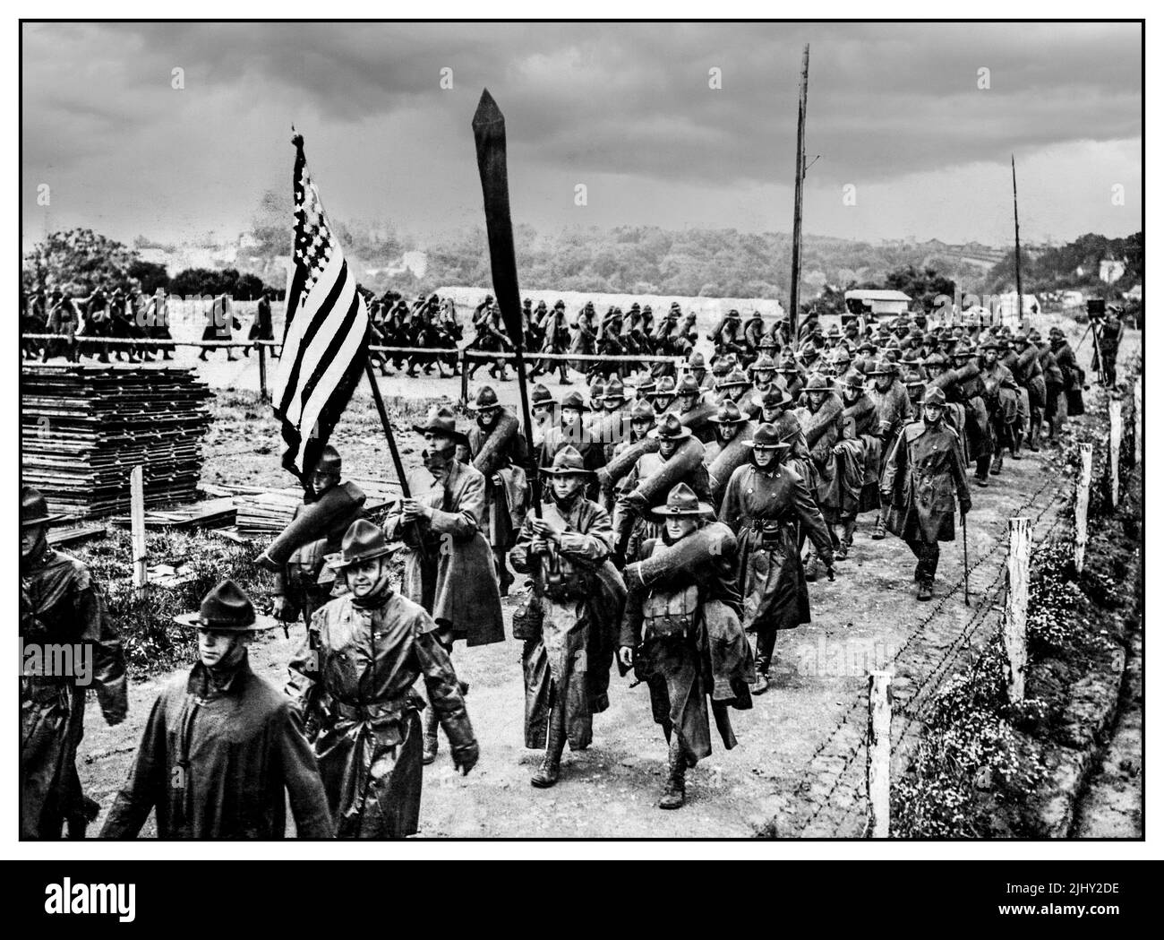 WW1 American Army Troops of the American Army parade at Le Havre, 12 July 1918. marching on to The Western Front in wet weather trench coats 1917-1918 WW1 World War 1 First World War Stock Photo