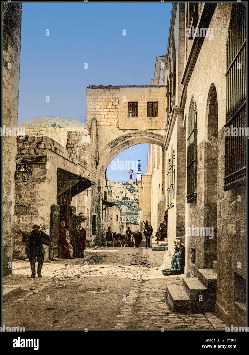 JERUSALEM Vintage Travel 1900s The Arch of Ecce Homo, Jerusalem, Holy Land. The Ecce Homo Arch is an impressive arch made of stone, built above the Via Dolorosa Street. This ancient arch is known as Ecce Homo, which means in Latin “This is the man”. Victorian Photochrom image technique 1900s Stock Photo