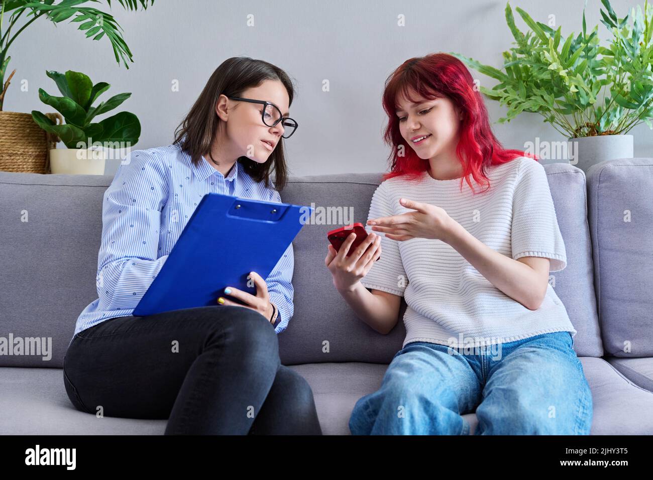 Psychologist counseling teenage female, individual therapy in doctors