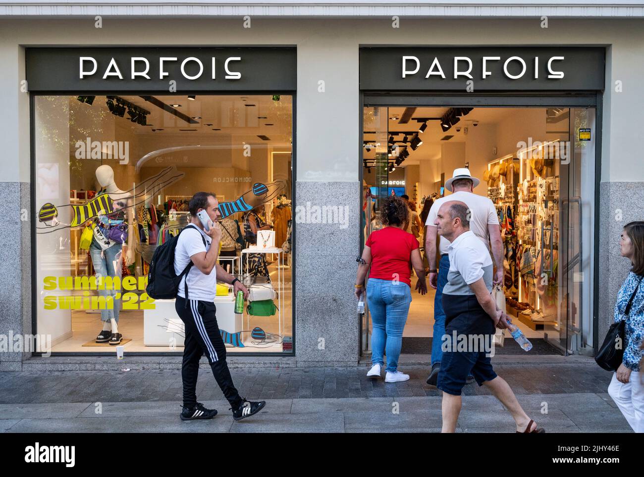Pedestrians and shoppers are seen at the Portuguese women's accessories  brand Parfois store in Spain. (Photo by Xavi Lopez / SOPA Images/Sipa USA  Stock Photo - Alamy