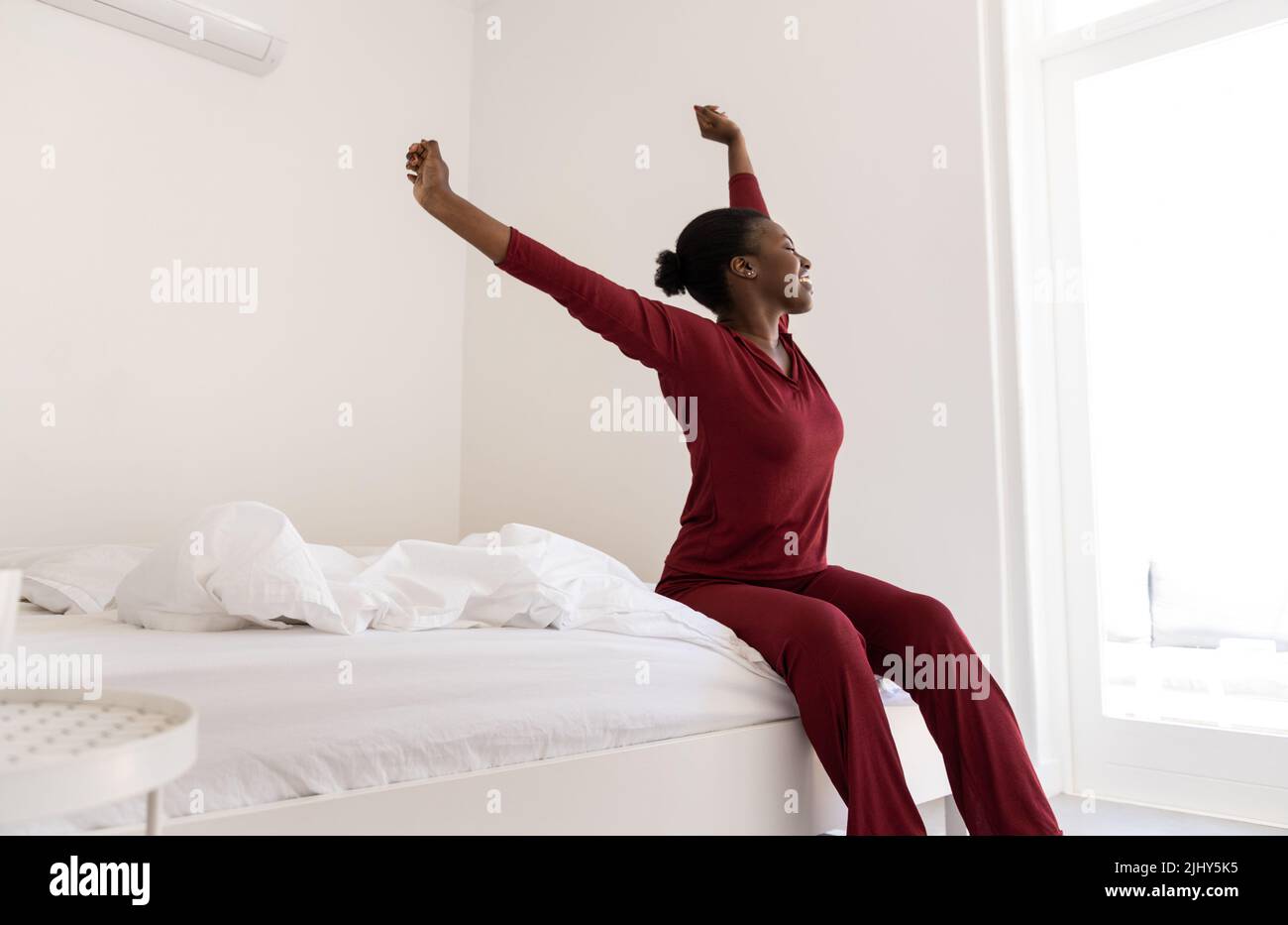 early-morning-routine-of-beautiful-black-african-woman-stretching-arms