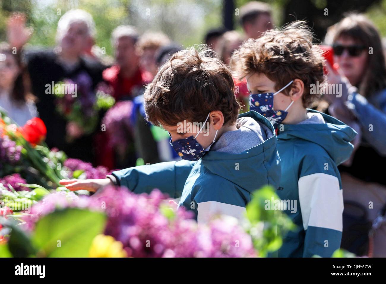 Odessa, Ukraine. 9th May, 2021. Twin children are seen laying flowers ...