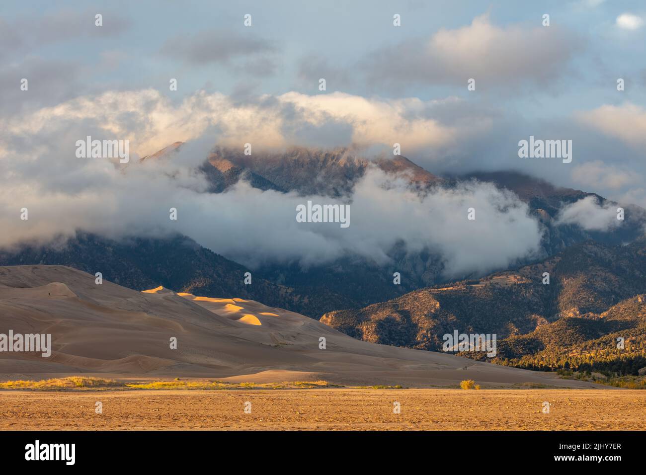 Evening light on the dunes and mountains, Great Sand Dunes National Park, Colorado Stock Photo