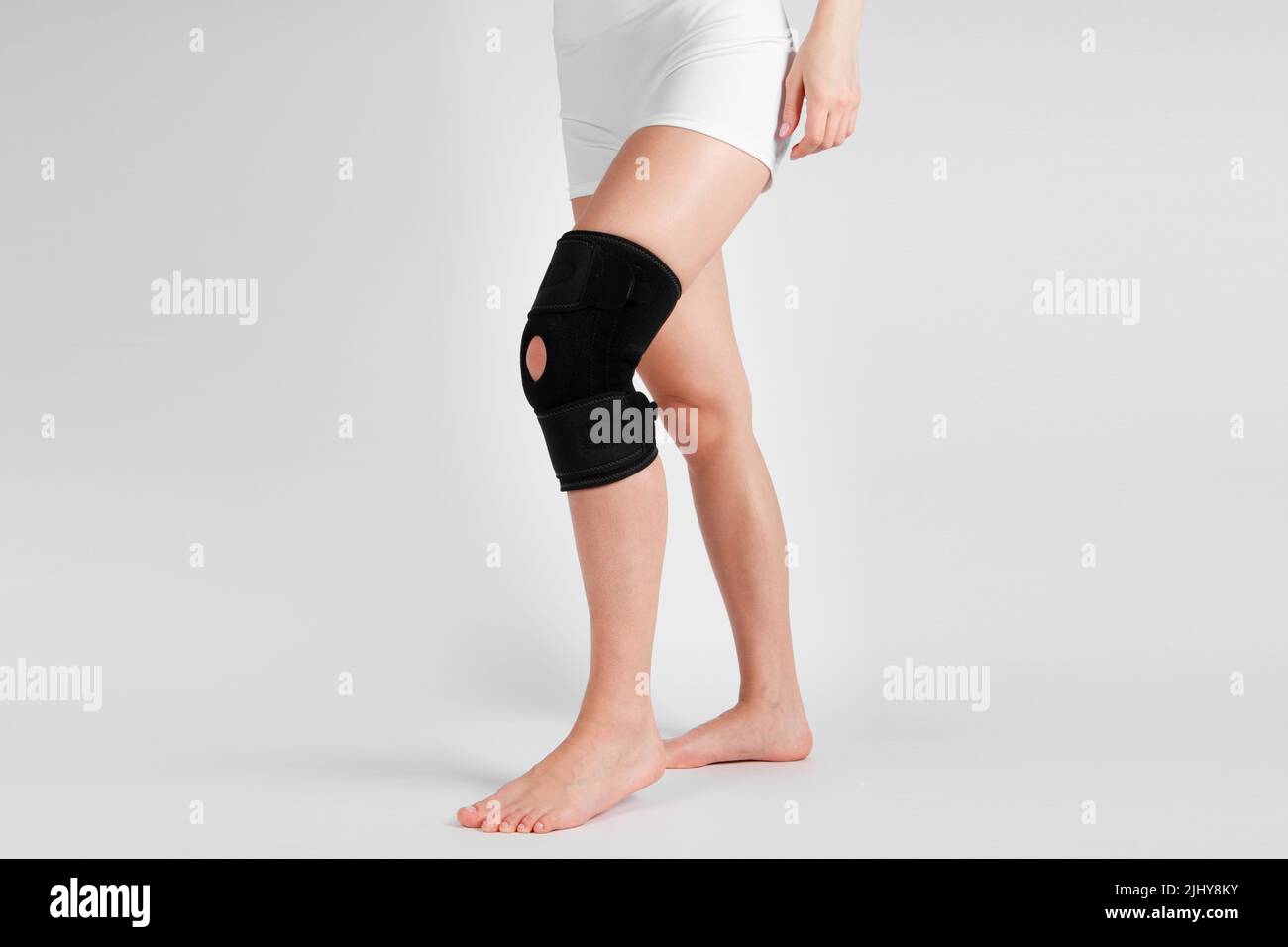 Knee Support Brace on leg isolated on white background. Elastic